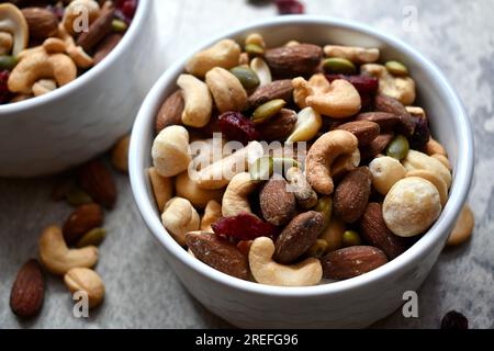 Healthy trail mix in a white bowl Stock Photo