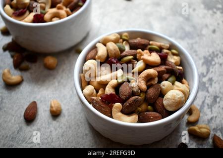 Healthy trail mix in a white bowl Stock Photo