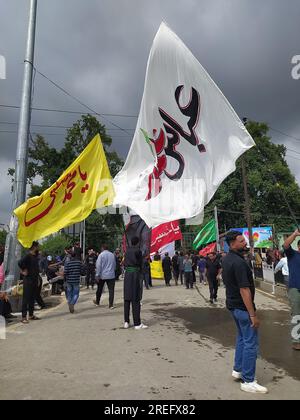 Shia muslims unfurling flags during muharram Procession Stock Photo