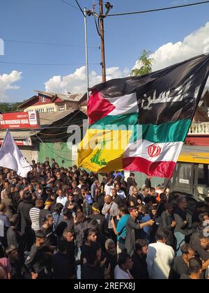 Shia muslims unfurling flags during muharram Procession Stock Photo