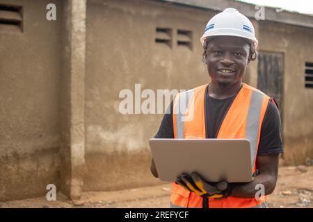 african engineer using his laptop computer Stock Photo