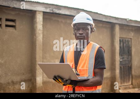 african engineer using his laptop computer Stock Photo