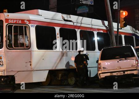 Philadelphia, United States. 27th July, 2023. Vehicle and train trolley collide in Philadelphia. A SEPTA trolley crashed into a building at the corner of Cobbs Creek Parkway and Woodland Avenue in Philadelphia. An SUV was involved in the accident Thursday evening. This is the fifth crash involving a SEPTA vehicle in less than a week in the Philadelphia area. (Photo by Kyle Mazza/SOPA Images/Sipa USA) Credit: Sipa USA/Alamy Live News Stock Photo