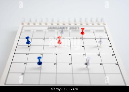Business management event, business plan targeted marketing activities. Embroidered pins on calendar event. Planner calendar, planning for business me Stock Photo