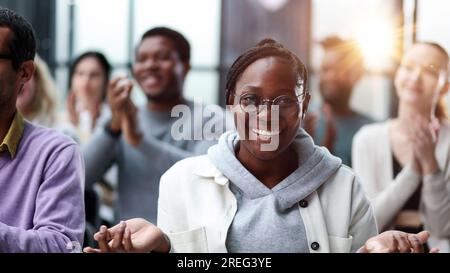 Businessmen attentively listen to the instructor at the lecture Stock Photo