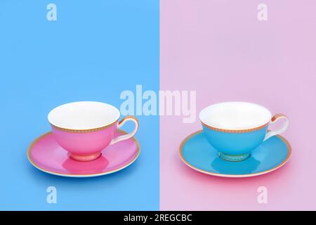 Tea for two with porcelain tea cups. Elegant luxury drinking duality reflection concept set on pastel baby blue and pink background. Stock Photo