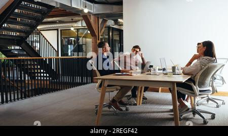 business people having a meeting in an advertising agency. Group of marketing professionals having a discussion in a boardroom. business team working Stock Photo