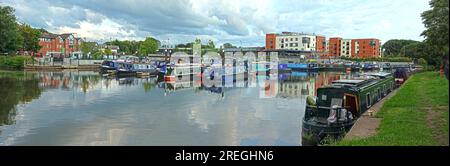 Wide panoramic view of Northwich Marina with moored narrowboats and waterside development, Northwich, Cheshire, England, UK CW9 5HD Stock Photo