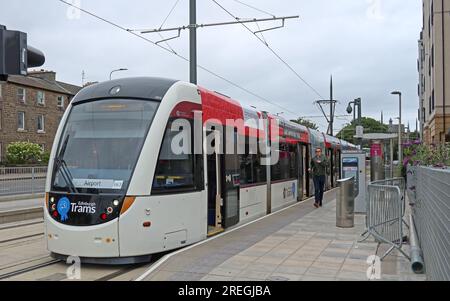Edinburgh Trams service to Edinburgh Airport at the Newhaven terminus, showing a modern CAF-built tram at the platform EH6 4DF Stock Photo