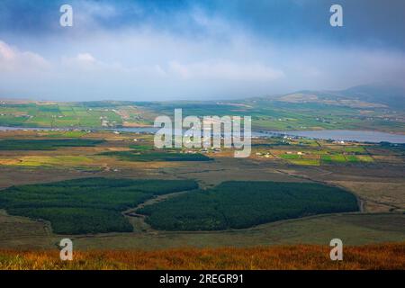 View over Portmagee and Valentia Island from inland on the Iveragh peninsula, County Kerry, Ireland, August. Stock Photo