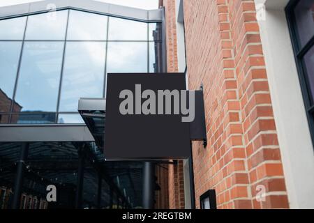 Signboard shop or restaurant. Mock up. Rectangular shape. Place for text, outdoor advertising, banner.  Stock Photo