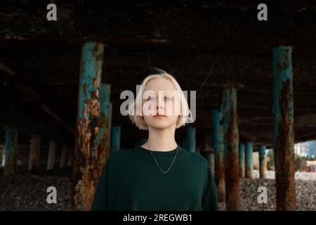 Strong young adult girl looking at camera outdoors Stock Photo