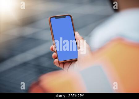Man, hands and phone mockup on rooftop for communication, construction or outdoor networking. Closeup of male person, architect or engineer working on Stock Photo