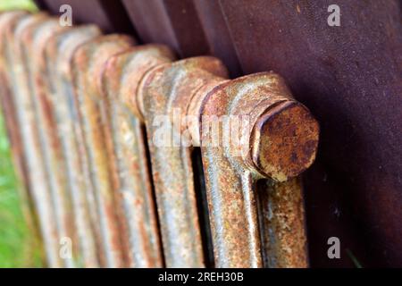 Rusty section of the heating battery in scrap metal Stock Photo