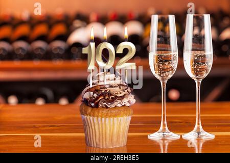 Cupcake With Number For Celebration Of Birthday Or Anniversary; Number 102. Stock Photo