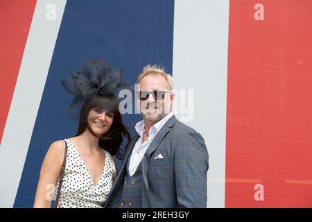 Ascot, Berkshire, UK. 28th July, 2023. Racegoers arriving at Ascot Racecourse for the first day of the QIPCO King George Weekend of horse racing. It was a dull day but pleasantly warm. Credit: Maureen McLean/Alamy Live News Stock Photo