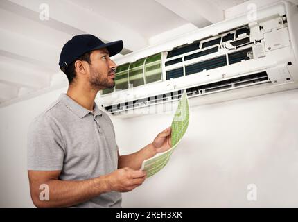 Handyman service, air conditioner technician and man, working on ventilation filter and ac repair. Contractor, maintenance or electric aircon machine Stock Photo