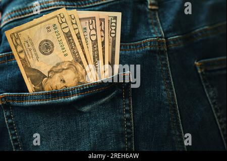 Banknotes of American dollars in pocket of jeans Stock Photo