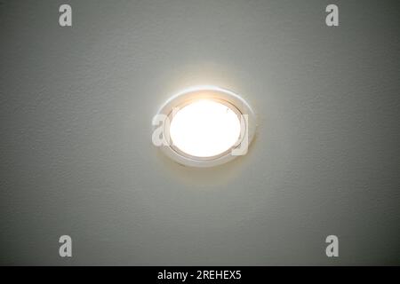 Light bulbs mounted on the ceiling with a white background. Close-up. Stock Photo