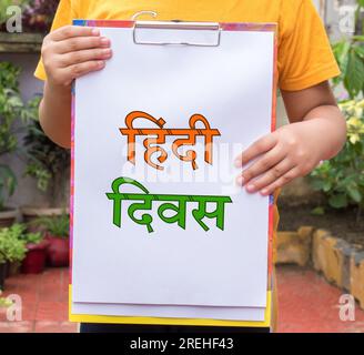 Hindi Diwas means Hindi Language Day word or text written on black