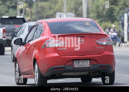 Chiangmai, Thailand -   June  17 2023: Private Eco car Mazda 2. On road no.1001 8 km from Chiangmai Business Area. Stock Photo