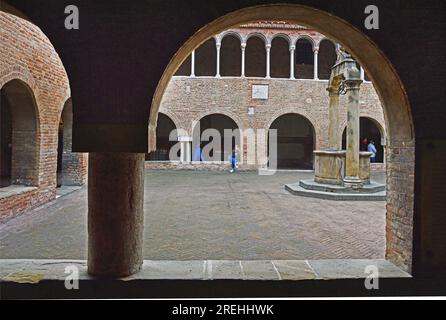 Inner courtyard of a medieval monastery in the complex of seven churches of St. Stephen in Bologna, Italy. November 12, 2022. Editorial photo Stock Photo