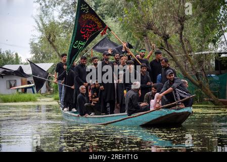 Kashmiri Shia Muslims holding flags chant religious poems during an ...