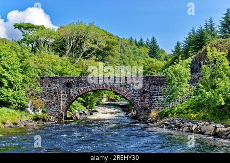 Lochinver Assynt Sutherland Scotland the Baddidaroch stone Road Bridge over the River Inver in summer Stock Photo