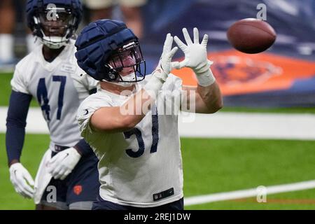 Chicago Bears linebacker Jack Sanborn (57) runs after the ball