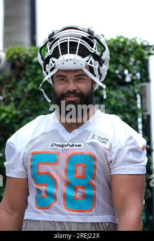 Miami Dolphins guard Connor Williams (58) hikes the ball during a