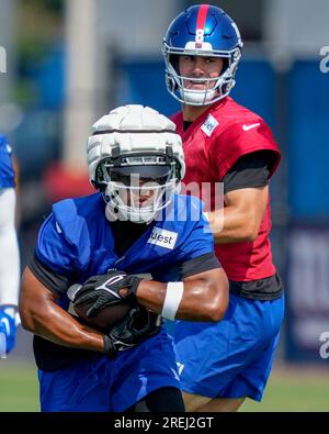 New York, USA. August 8, 2019, East Rutherford, New Jersey, USA: New York  Giants quarterback Daniel Jones (8) celebrates with running back Saquon  Barkley (26) after throwing his first touchdown pass during