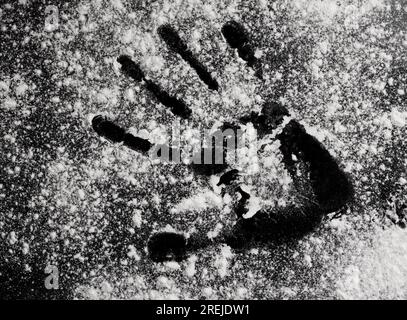 Hand print on wheat flour Stock Photo