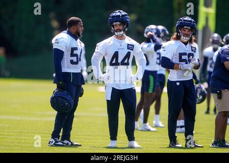 Seattle Seahawks linebacker Lakiem Williams, left, and fullback Nick Bellore,  right, celebrate after a play against the Denver Broncos during the second  half of an NFL football preseason game, Saturday, Aug. 21