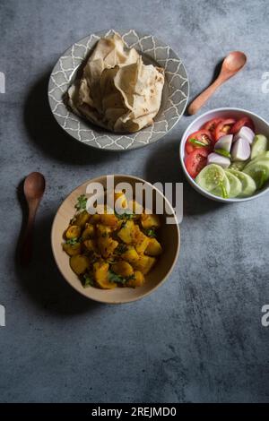 Indian veg lunch rumali roti or Indian bread and alu jeera or potato masala Stock Photo