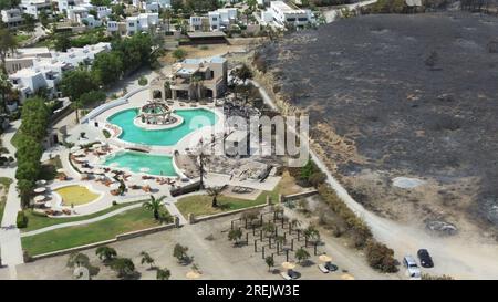 Tourist resorts near the town of Lardos on the Greek island of Rhodes, where the fire stopped just short of the walls of the complexes, Greece, July 2 Stock Photo