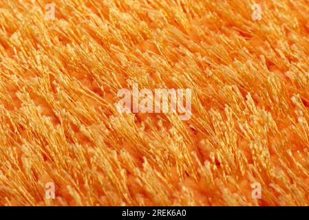 Texture of orange terry bath towel. Carpet background Stock Photo