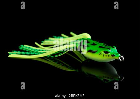 https://l450v.alamy.com/450v/2rek8h3/silicone-frog-top-water-bait-for-pike-or-large-mouth-bass-fishing-isolated-on-black-background-2rek8h3.jpg