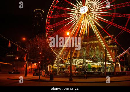 The SkyView Atlanta Ferris wheel stands out in the vibrant downtown Atlanta night. Stock Photo