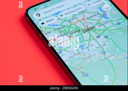 New York, USA - July 21, 2023: Car traffic in Dallas on google maps in smartphone screen close up view Stock Photo