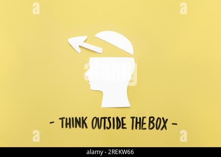 Open human brain with arrow symbol near think outside box message. Resolution and high quality beautiful photo Stock Photo