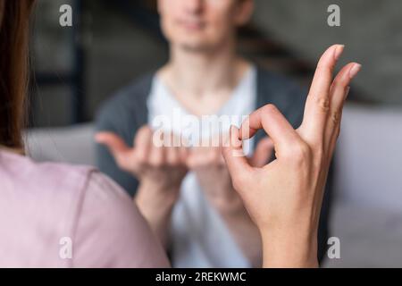 Couple talking using sign language. Beautiful photo Stock Photo