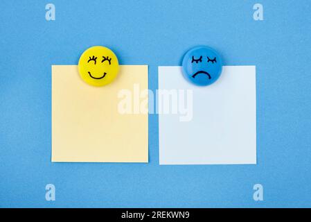 Flat lay faces with emotions sticky notes blue monday. Beautiful photo Stock Photo