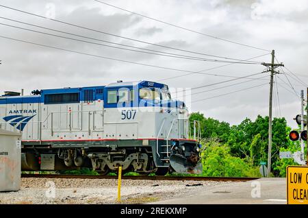 Amtrak Engine 507 passes the Graveline Road intersection, May 11, 2023, in Gautier, Mississippi. Stock Photo