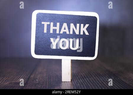 Asian boy holding a blackboard with the words Thank You with smile. Stock Photo