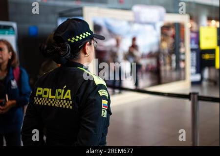 Bogota, Colombia. 28th July, 2023. A Colombian police officer looks during a play showing the risks and the ways in which people are tricked into illegal human trafficking networks, at El Dorado International Airport in Bogota, Colombia July 28, 2023. Photo by: Sebastian Barros/Long Visual Press Credit: Long Visual Press/Alamy Live News Stock Photo