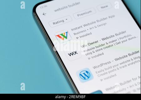 New York, USA - July 27, 2023: Website builder app for smartphone in google store on smartphone screen close up Stock Photo