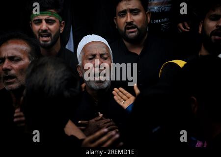 Srinagar, India. 28th July, 2023. A Shiite Muslim reacts during a Muharram procession on the ninth day of Ashura in the interiors of Dal Lake in Srinagar on July 28, 2023. Ashura is a period of mourning in remembrance of the seventh-century martyrdom of Prophet Muhammad's grandson Imam Hussein, who was killed in the battle of Karbala in modern-day Iraq, in 680 AD (Photo by Mubashir Hassan/Pacific Press) Credit: Pacific Press Media Production Corp./Alamy Live News Stock Photo