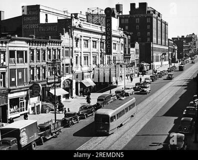 New York, New York:  1940 Looking east on 9th Street in Brooklyn with a streetcar running in front of the Prospect movie theater. Stock Photo