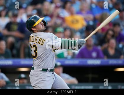 Tampa Bay Rays' Isaac Paredes, right, hits a two-RBI single during the  fourth inning of a baseball game as Oakland Athletics catcher Shea  Langeliers, left, watches Saturday, April 8, 2023, in St.