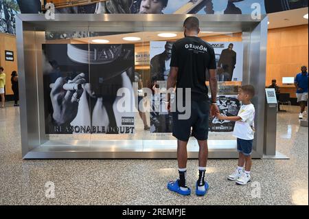 New York, USA. 27th July, 2023. People tour ‘The Book of HOV' exhibition inside the Brooklyn Public Library celebrating the work of rapper and artist Shawn ‘Jay-Z' Carter, in the New York City borough of Brooklyn, NY, July 27, 2023. (Photo by Anthony Behar/Sipa USA) Credit: Sipa USA/Alamy Live News Stock Photo
